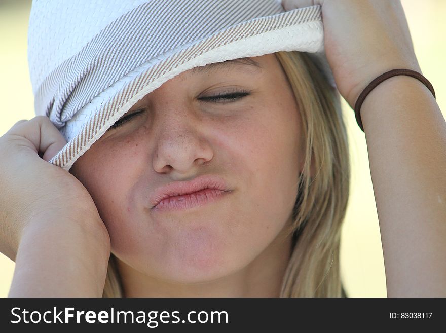 Woman in White and Grey Fedora Hat