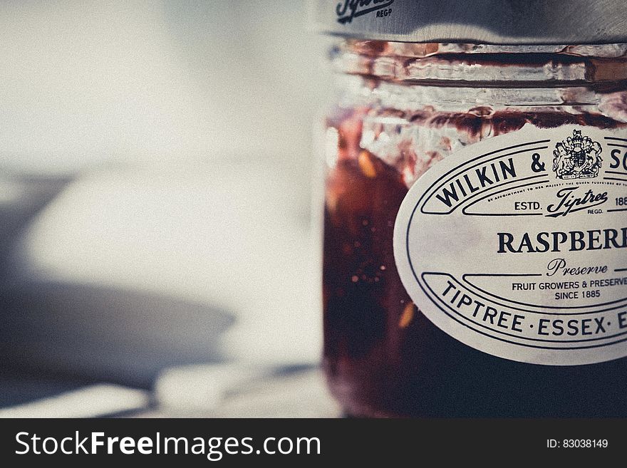 Close up of jar of English raspberry preserves.