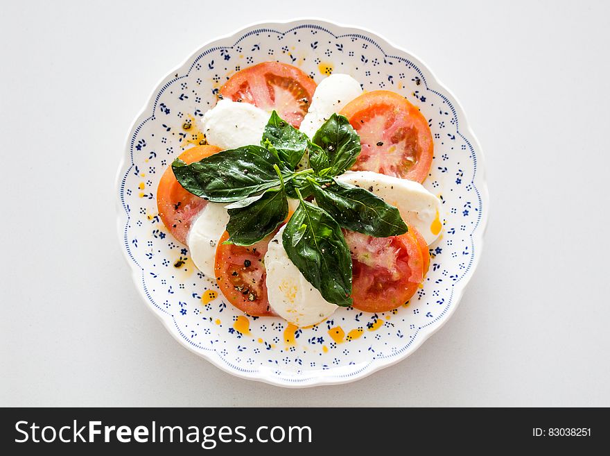 Vegetable Salad on White and Blue Round Floral Plate
