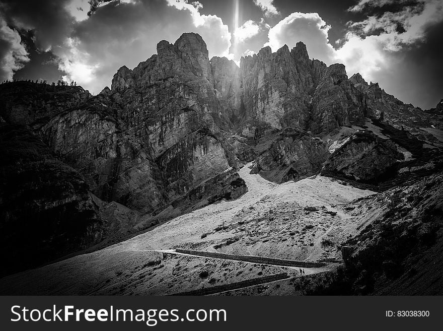 Greyscale Photography of Mountain Under Clouds