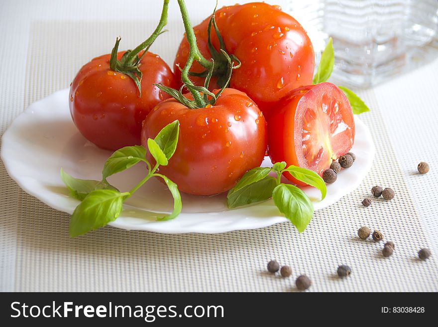 Tomato Top Of White Ceramic Plate