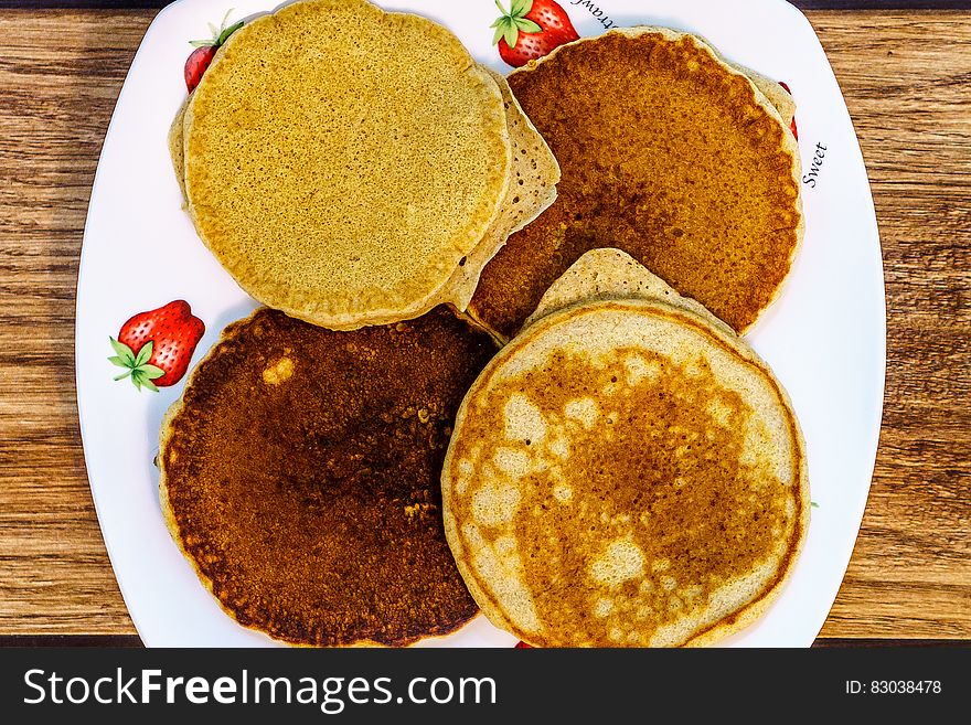 A plate of fried pancakes. A plate of fried pancakes.