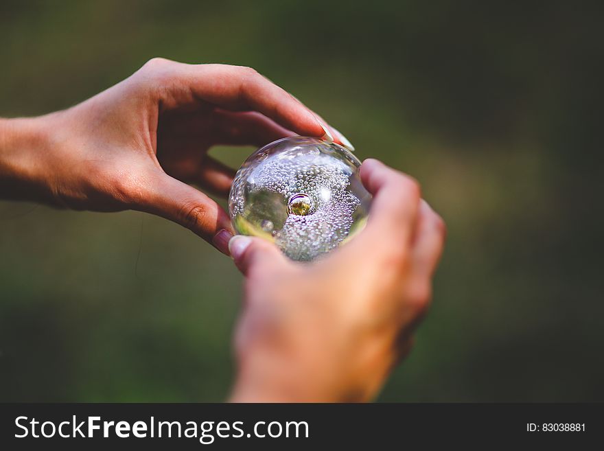 Crystal ball in hands