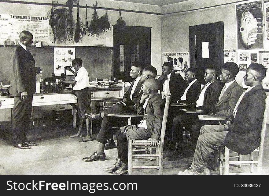 Vintage segregated classroom with African students and teacher. Vintage segregated classroom with African students and teacher.