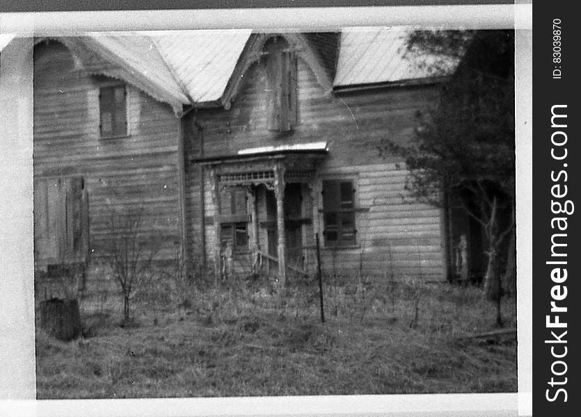 Exterior of old wooden house in Belleville circa 1970 in black and white. Exterior of old wooden house in Belleville circa 1970 in black and white.