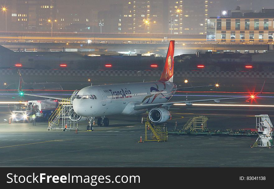 Commercial jet on apron of airport at night. Commercial jet on apron of airport at night.