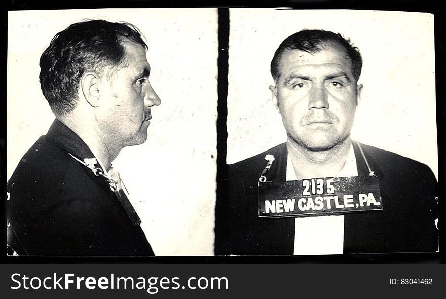 A black and white identification photo of a man being sentenced to prison. A black and white identification photo of a man being sentenced to prison.