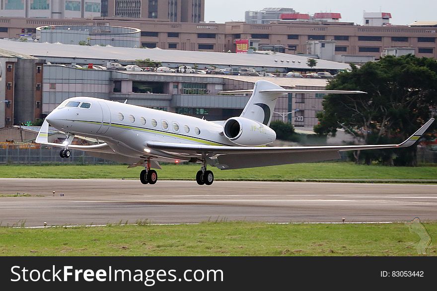 Private jet on take off on airport runway.