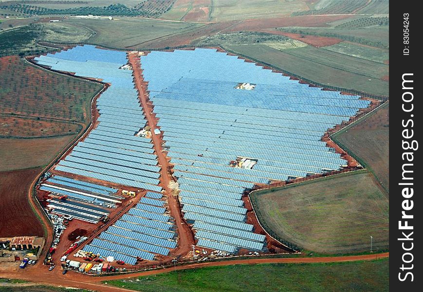 Aerial view over large field of solar panels in countryside. Aerial view over large field of solar panels in countryside.