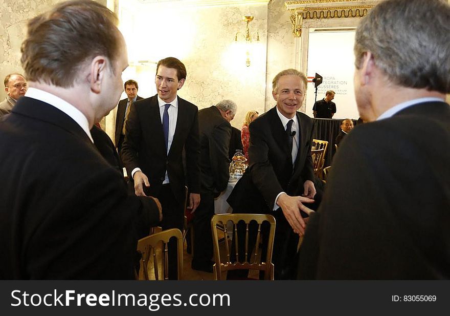 Business men meeting and greeting inside room. Business men meeting and greeting inside room.