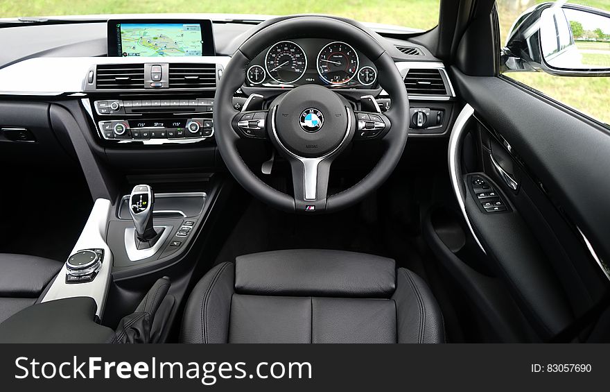 Leather interior of luxury BMW car on sunny day. Leather interior of luxury BMW car on sunny day.