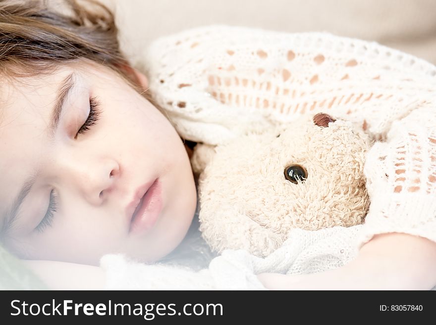 Girl Sleeping With Her Brown Plush Toy