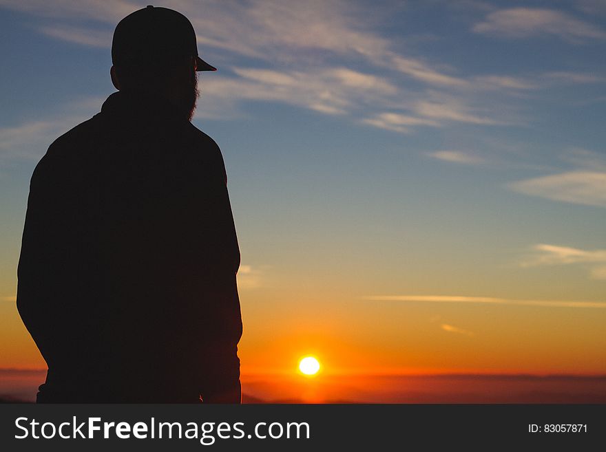 Silhouette Of A Man With Sunset Fixture