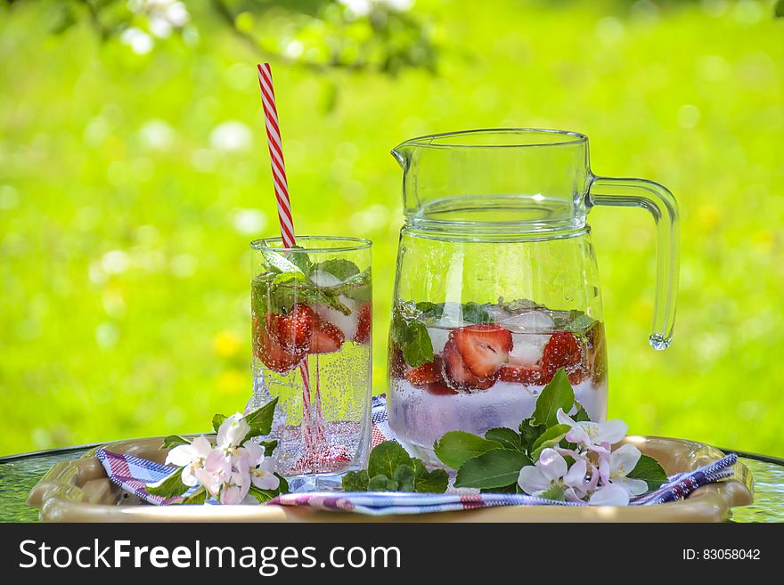 Clear Glass Pitcher With Water And Strawberry