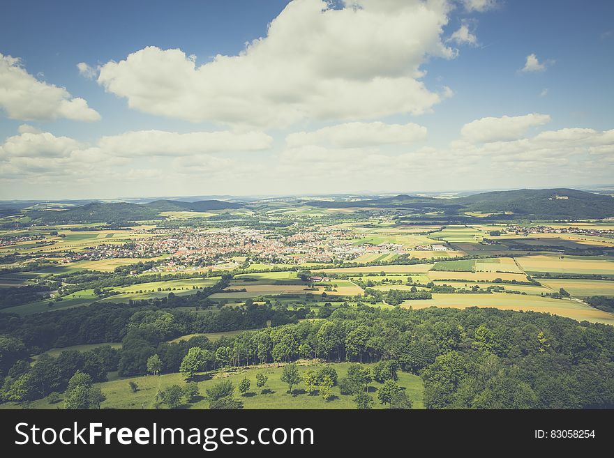 Aerial Photography of Green Fields Under Blue Sky and White Clouds during Daytime