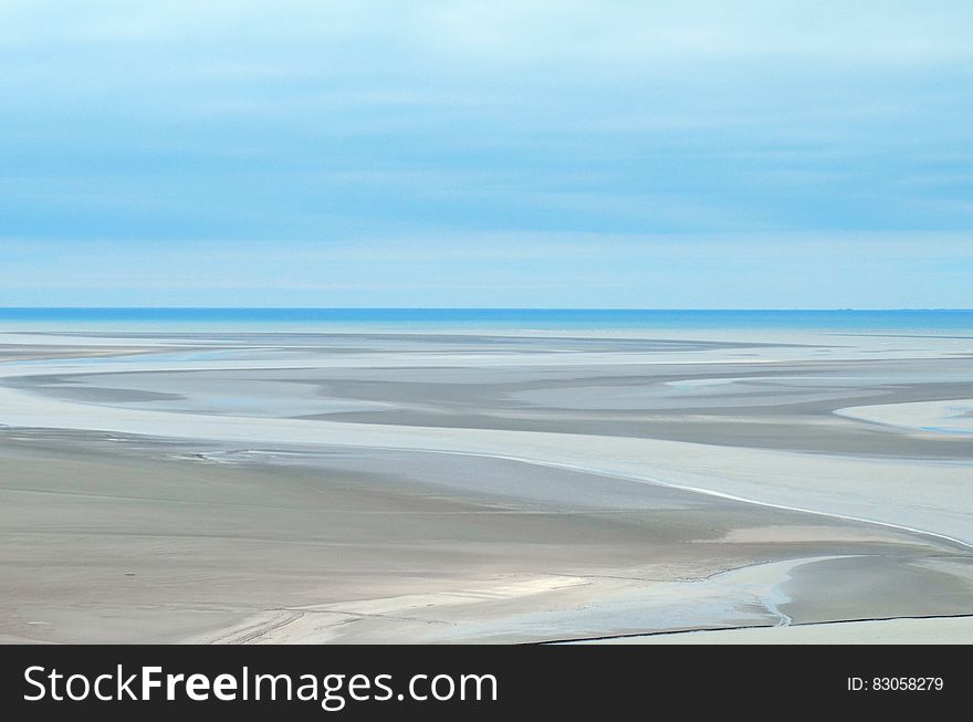 Gray Sand Dunes Under Blue Sky