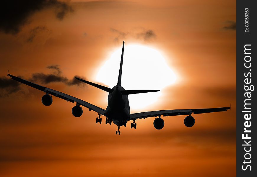 Shadow Image of a Plane Flying during Sunset