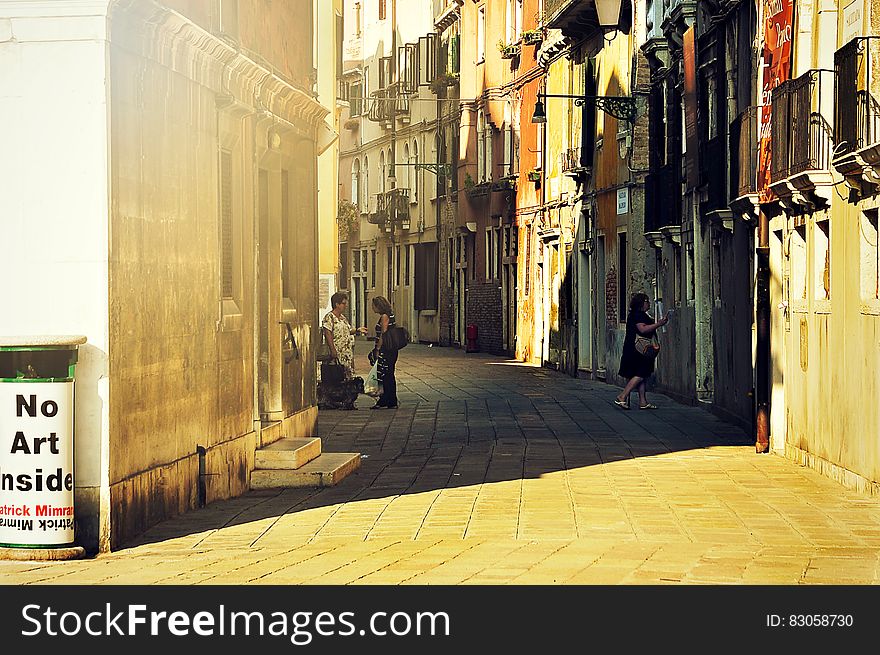 3 Person Standing In Alley