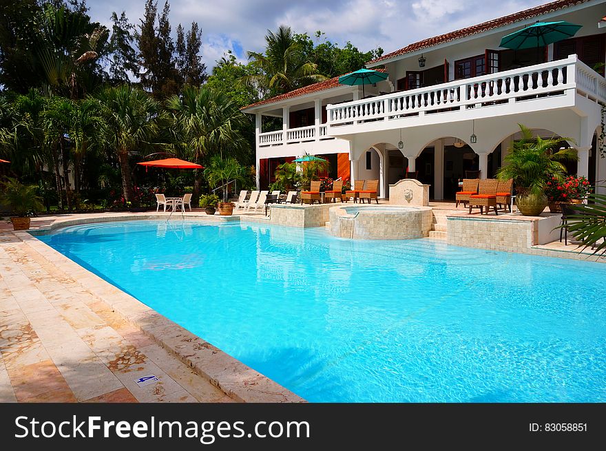 Red Outdoor Chair Near In Swimming Pool