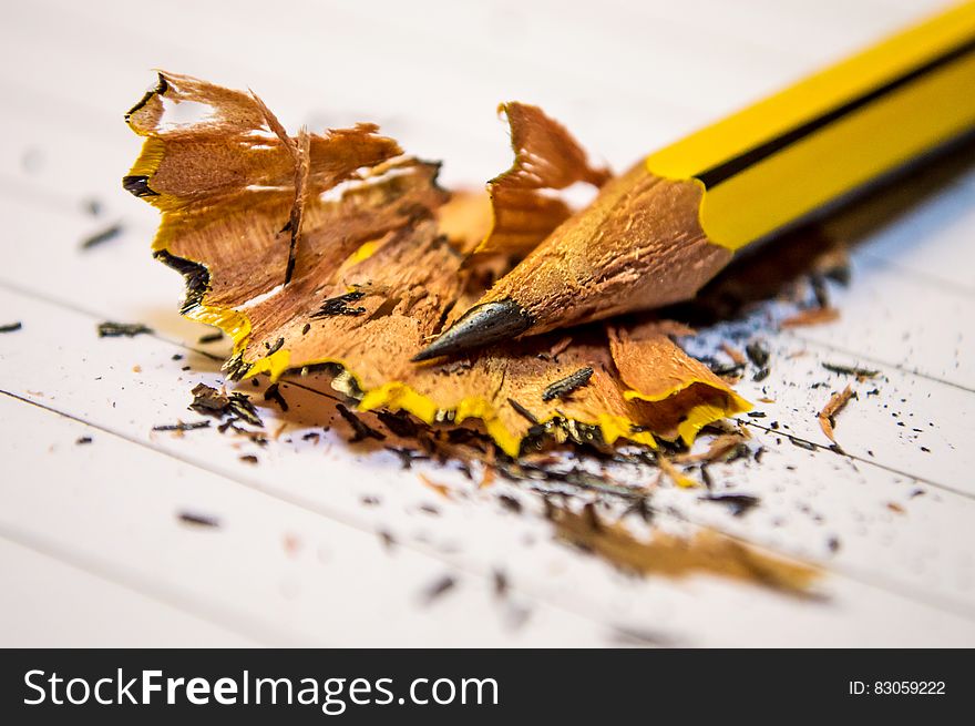 Yellow Black Pencil Sharpened Above The White Paper In Macro Photography