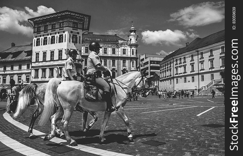 2 Man Riding A Horse In Gray Scale Photography