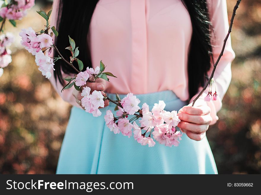 Woman Holding Pink Flowers