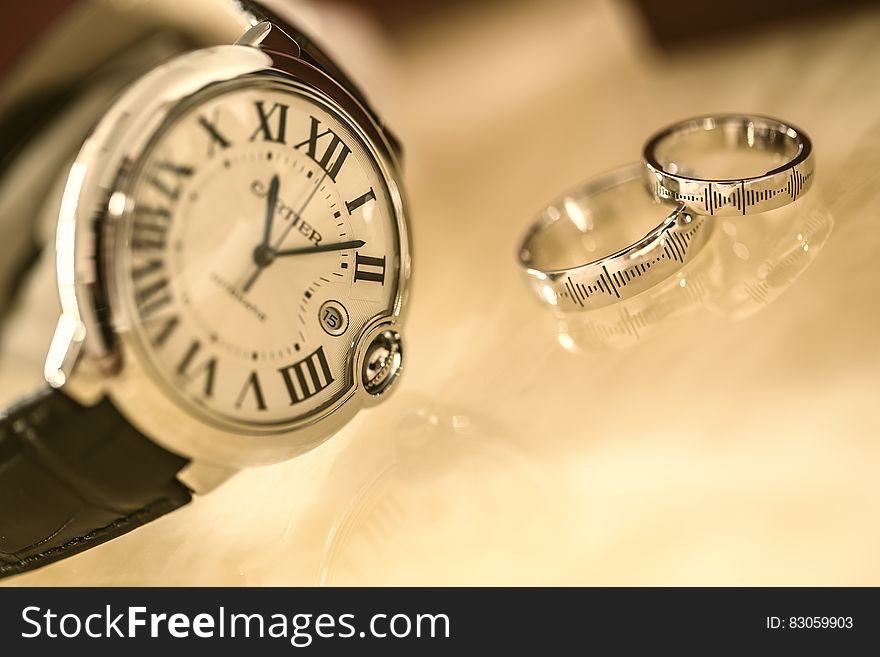 Silver Wedding Rings Near Silver Round Analog Watch