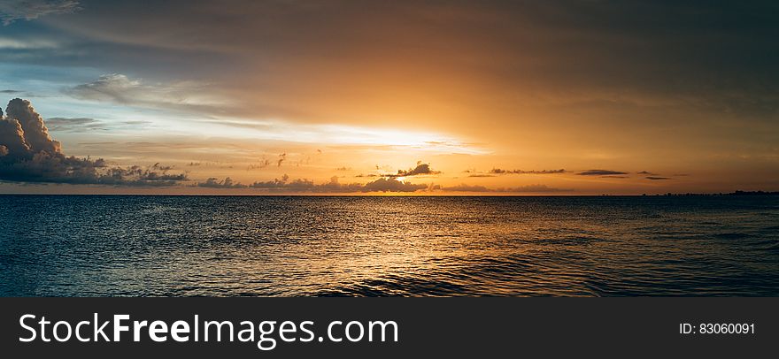 Scenery Of Sea Water During Sunset