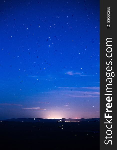 Silhouette of Mountain Range Under Stars