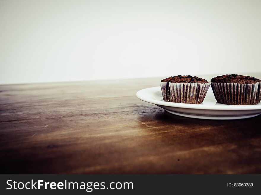 Brown Cupcake on White Ceramic Plate