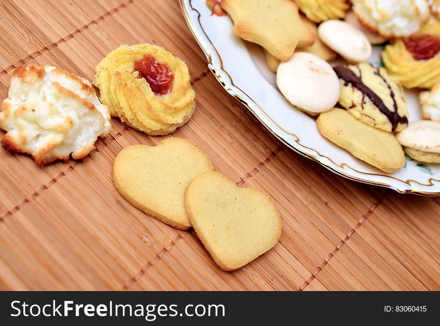 Close up of Christmas cookies on china plate and bamboo mat. Close up of Christmas cookies on china plate and bamboo mat.