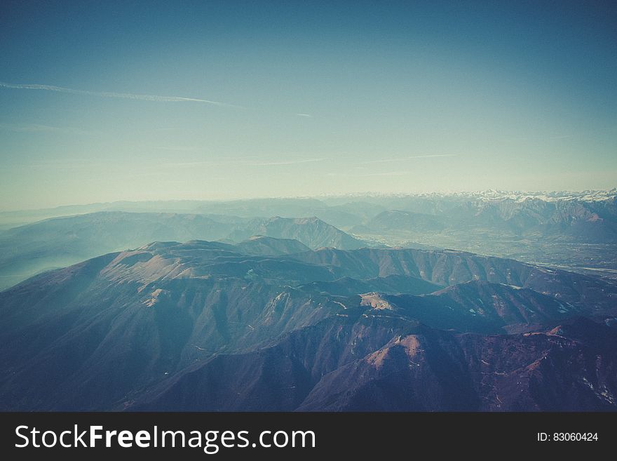 Aerial Photography of Mountain Under Sunny Blue Sky