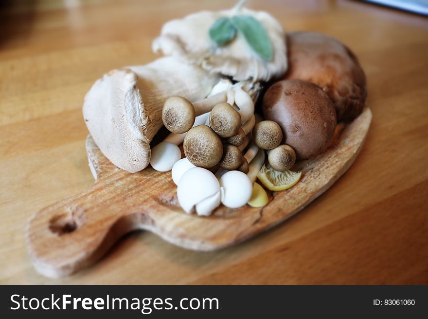 Mushroom On Brown Wooden Plate