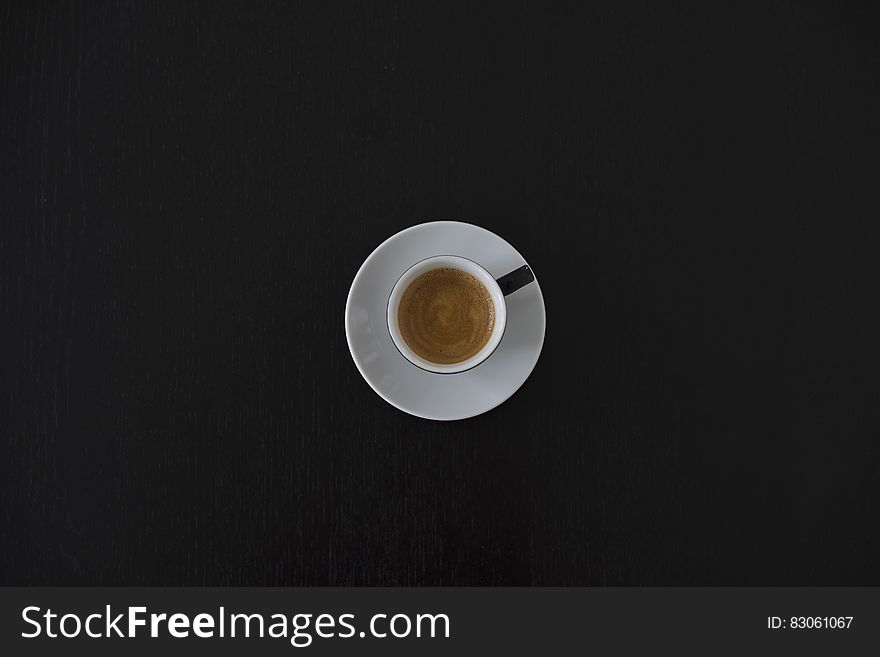 White Ceramic Coffee Cup on White Saucer