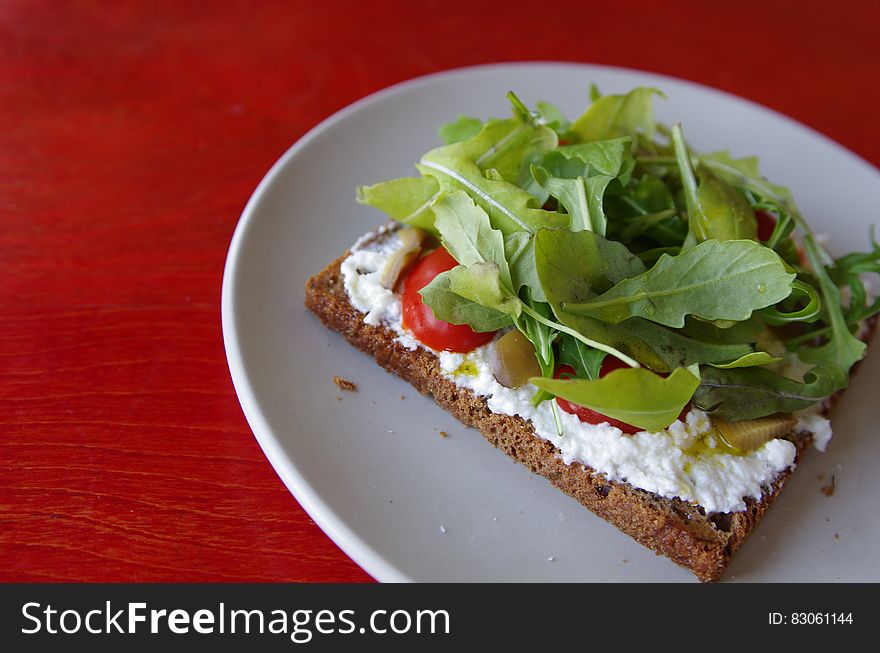 Baked Pastry With Cream And Salad On Top