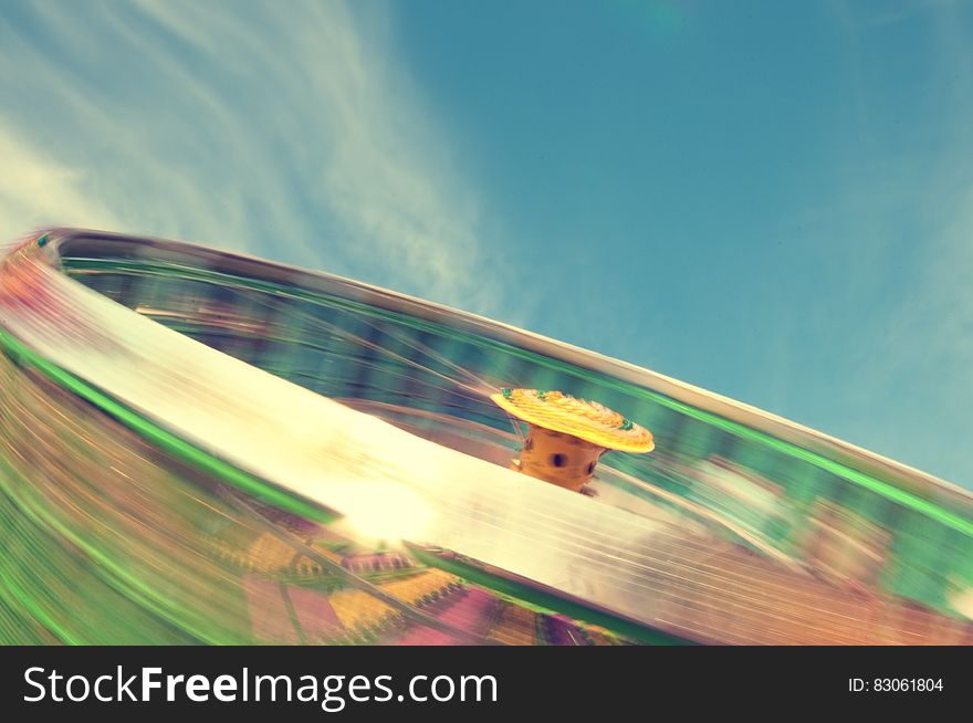 A spinning roundabout in an amusement park. A spinning roundabout in an amusement park.