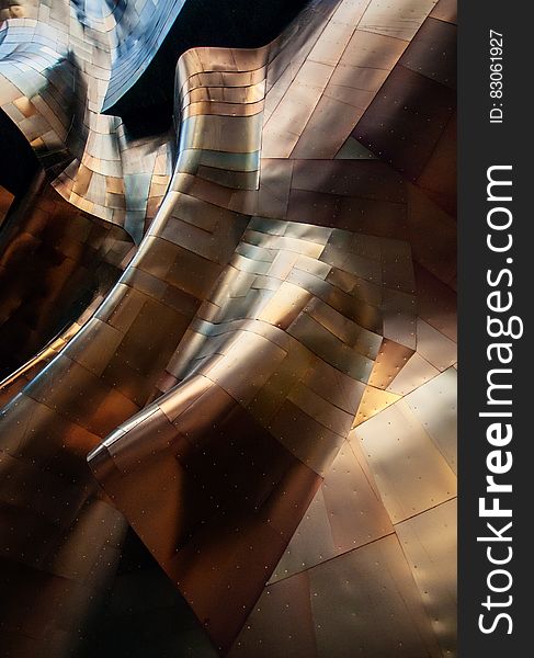 Close up of curved metallic abstract architecture.