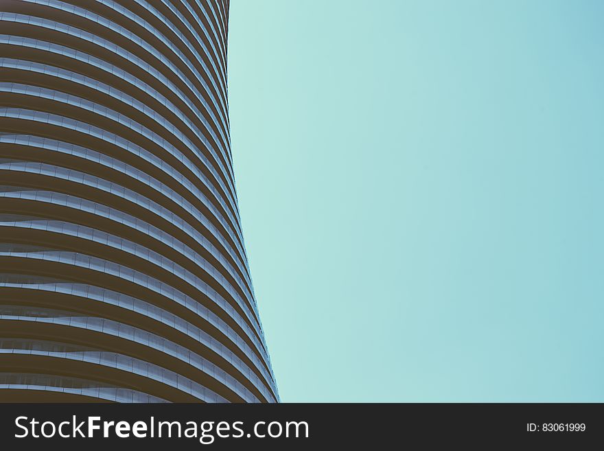 Facade of modern architecture against blue skies on sunny day.