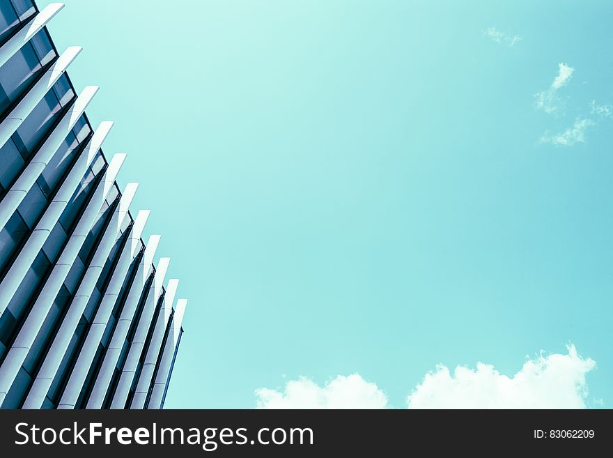 High Rise Building Under White Clouds And Blue Sky