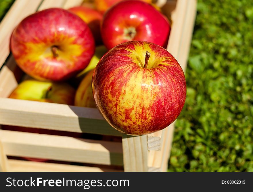 Red Yellow Apples on Wooden Basket