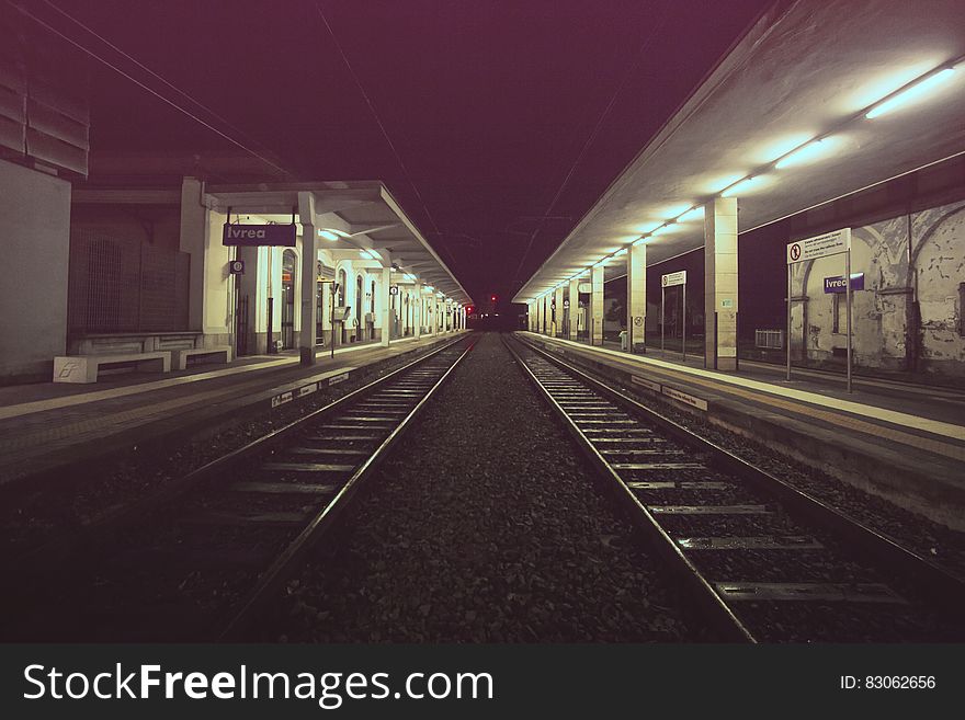 Empty railroad platform at night