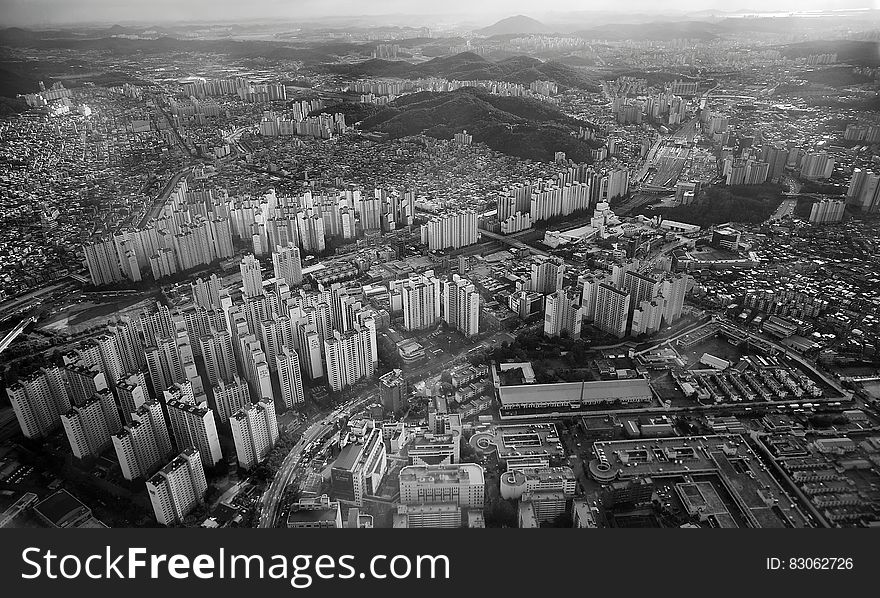 Grey High Rise Buildings Capture from High Angle in Greyscale Photo