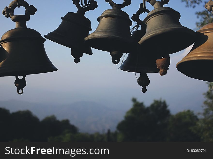 Photography of Black Hanging Bells during Daytime