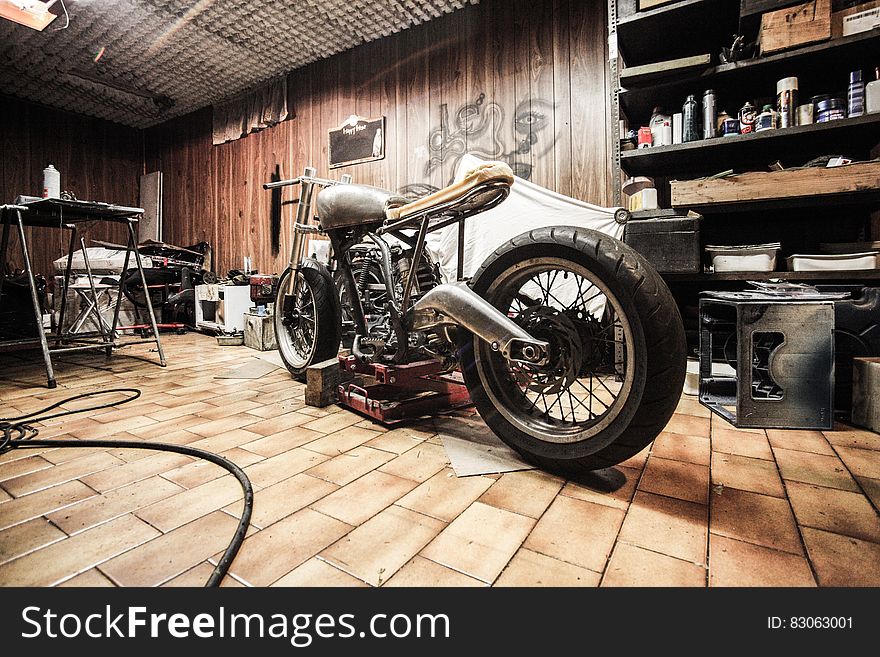 Motorcycle inside mechanics garage and workshop. Motorcycle inside mechanics garage and workshop.