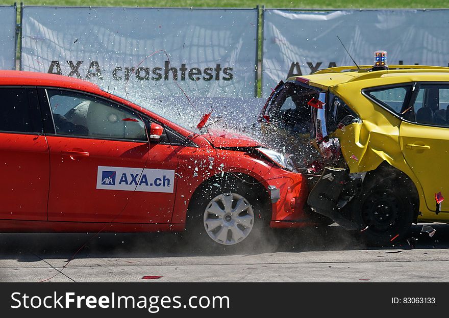 Red and Yellow Hatchback Axa Crash Tests
