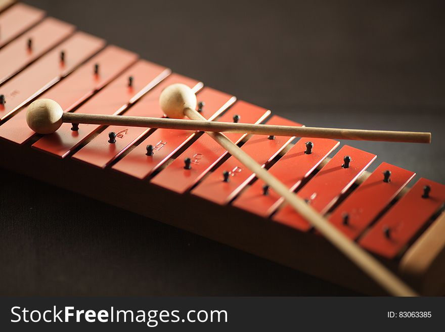 Shallow Focus Photography of Red Xylophone
