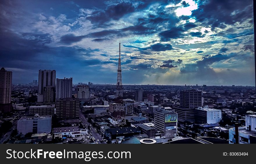 Aerial View Of City During Cloudy Sky