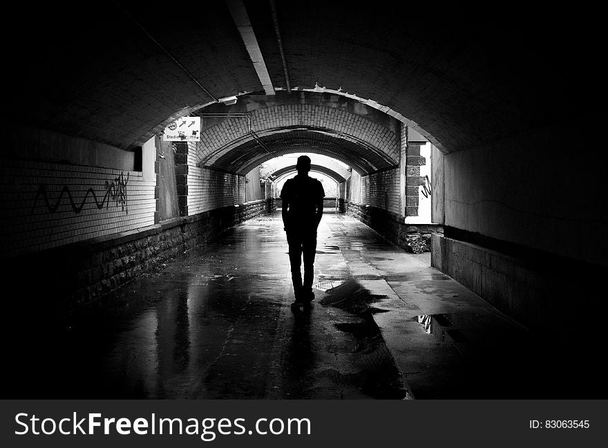 Silhouette Photo Of A Man In A Tunnel