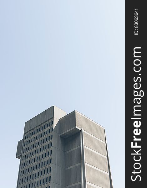 Modern Skyscraper Against Blue Skies