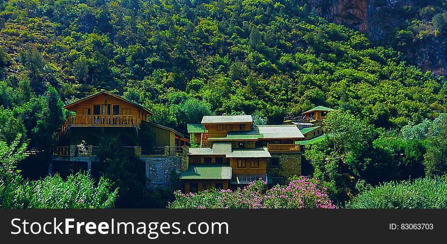 Brown And Green House In Mountain During Daytime